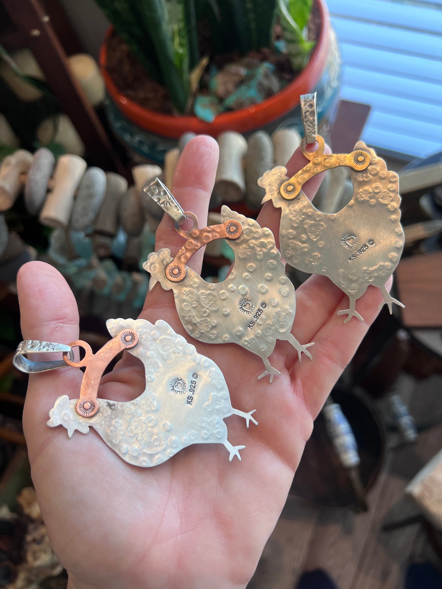 The Nizhoni Cluckers: Hand Stamped and Layered Sterling Silver, Brass, Copper & Kingman Turquoise Chicken Pendants by Kimari Somers