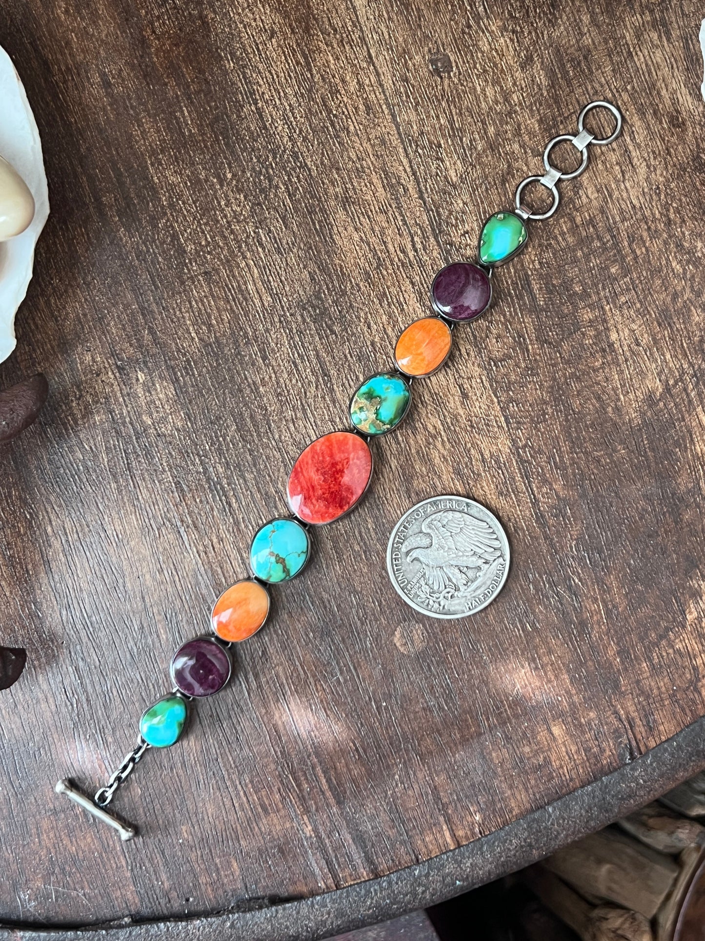 Loretta Delgarito Sterling Silver Electric Rainbow Link Turquoise and Spiny Oyster Bracelet: Ovals, Circles and Pears