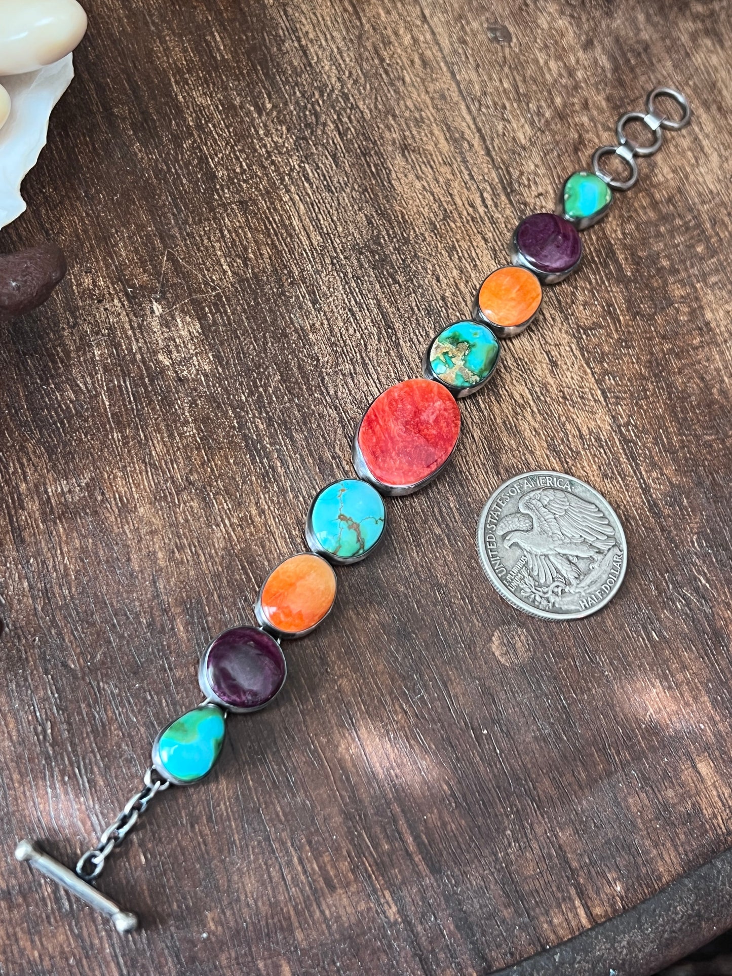 Loretta Delgarito Sterling Silver Electric Rainbow Link Turquoise and Spiny Oyster Bracelet: Ovals, Circles and Pears